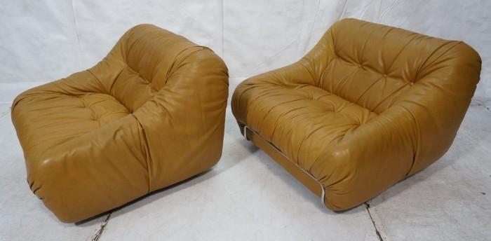 Lot 681  -  Pr Light Brown Leather Lounge Chairs. Chrome Tubular Base on Casters. Slouch pillow form seat. Not marked-- Dimensions:  H: 28 inches: W: 36 inches: D: 34 inches --- 