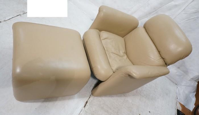 Lot 682  -  Modernist Leather Chair & Ottoman. Solid side arms. Tan leather. Not marked. -- Dimensions:  H: 32 inches: W: 36 inches: D: 30 inches --- 