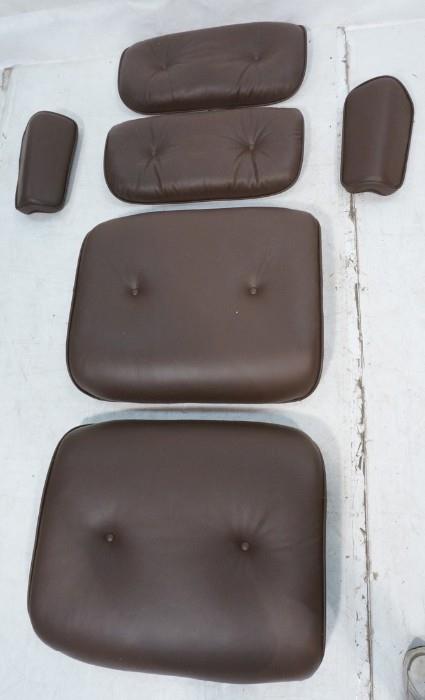 Lot 683  -  EAMES Replacement Parts Herman Miller Lounge Chair. Complete set plus on extra seat cushion. Chocolate Brown Leather. Not signed, may be aftermarket cushions.-- Dimensions:   --- 