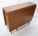 Lot 687  -  Drop Side Dining Table. Banded Wood. Tapered peg legs.  Drops are 21.5"H x 33.5"W. Not marked.-- Dimensions:  H: 28.5 inches: W: 11 inches: D: 33.5 inches --- 