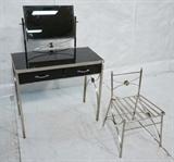 Lot 692  -  Vintage Metal Vanity & Chair. Chromed metal frame with black wood front drawers. Swivel mirror. -- Dimensions:  H: 44 inches: W: 30.5 inches: D: 16 inches --- 