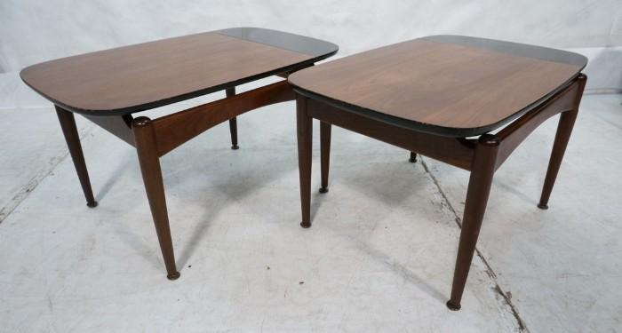 Lot 708  -  Pr American Modern Walnut End Tables. Black Formica edge detail. Arched skirts. -- Dimensions:  H: 16 inches: W: 28 inches: D: 19 inches --- 