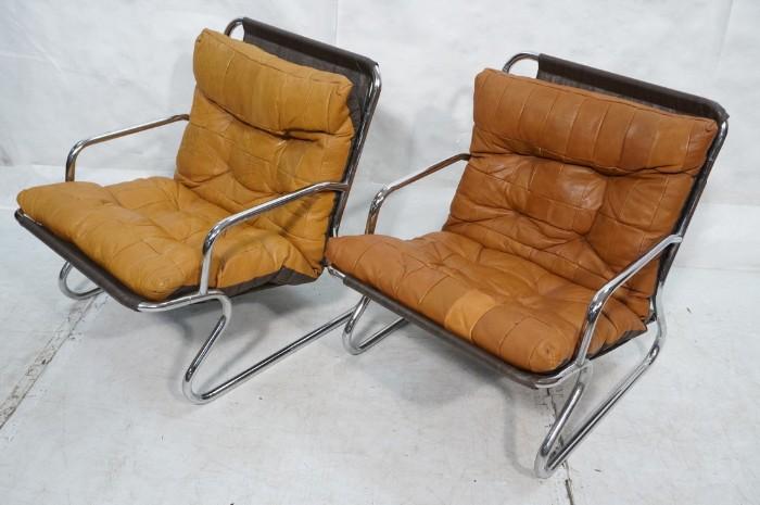 Lot 715  -  Pr  70's Modern Chrome & Leather Lounge Chairs. Patchwork leather cushions. Tubular chrome frame.-- Dimensions:  H: 27.25 inches: W: 23 inches: D: 26 inches --- 