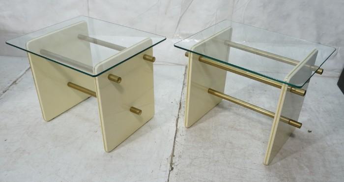 Lot 716  -  Pr Modern White Lacquer Glass Top End Tables. Gold Tone Rod Stretchers. -- Dimensions:  H: 20.5 inches: W: 26 inches: D: 21 inches --- 