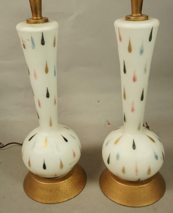 Lot 724  -  Pr Frosted Glass Table Lamps. Painted teardrop pattern. Gold painted metal trim.-- Dimensions:  H: 33 inches: W: 7 inches --- 