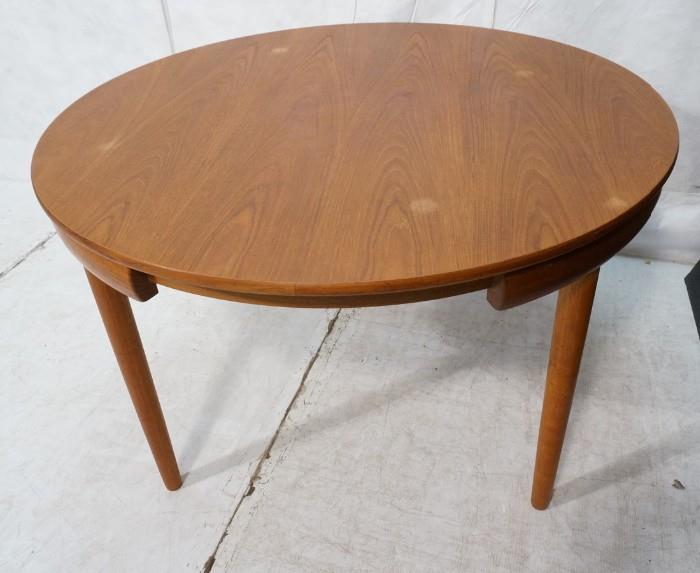 Lot 741  -  Danish Teak Modernist Dining Table. HANS OLSEN style. FREM ROJLE style. Has inset notches for matching chairs. -- Dimensions:  H: 29.25 inches: W: 47.25 inches --- 