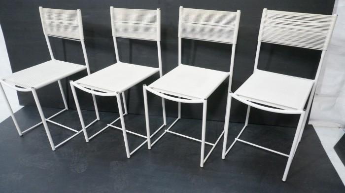 Lot 744  -  4pc White Italian Spaghetti Side Dining Chairs. Thin tube frame with wrapped white details. -- Dimensions:  H: 33 inches: W: 15.5 inches: D: 18 inches --- 