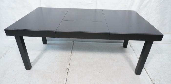 Lot 747  -  Herman Miller GEROGE NELSON Black Dining Table. Ebonized Finish Table with deep skirt. Thick square legs. Unique leaf design with concealed leaves.-- Dimensions:  H: 29.25 inches: D: 39.75 inches --- 