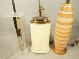 Lot 770  -  3pc Table Lamp Lot. 1. Lucite Box frame with stacked chrome elements. 2). Tessellated design oval lamp with metal trim 3). Tall Pottery lamp on wood base.  -- Dimensions:  H: 27.5 inches: W: 7 inches --- 
