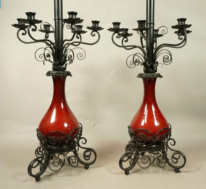 Lot 784  -  Pr Wrought Iron Red Pottery Lamps. Fancy iron scroll work. Six arm candle holders.-- Dimensions:  H: 38.5 inches: W: 14 inches: D: 14 inches --- 