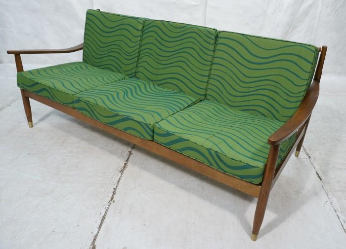 Lot 789  -  Long Modern Walnut Sofa Couch. Six loose pillows in green fabric. Spindle back. Marked.-- Dimensions:  H: 31 inches: W: 76 inches: D: 32 inches --- 