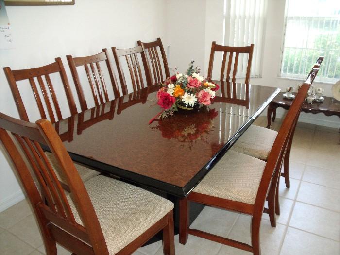 Bassett Dining table with 8 chairs and 1 leaf (not in table).