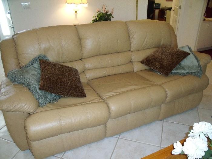 Vinyl couch with recliners at each end.  
