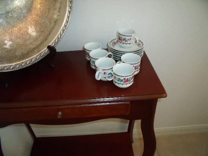 Tea set on lovely small wood table with drawer
