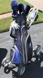 Ladies Taylor-Made Firesole Irons and various woods on a 4-wheel push cart