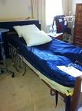 Hospital bed with Alta Dyne alternating pressure mattress system.