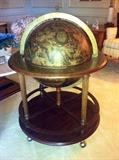 Nice large globe on wheeled stand.  Opens up to be a bar.
