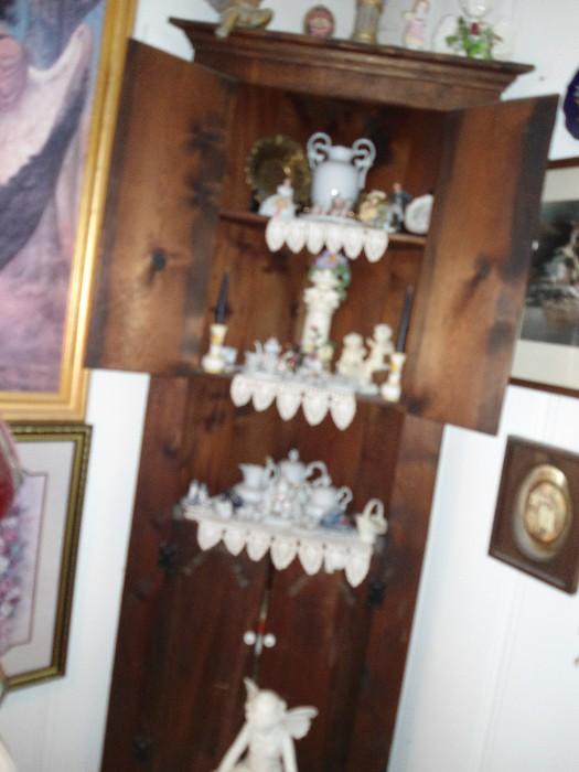Pine Corner Cabinet loaded with several sets of minature porcelain, etc. teasets...