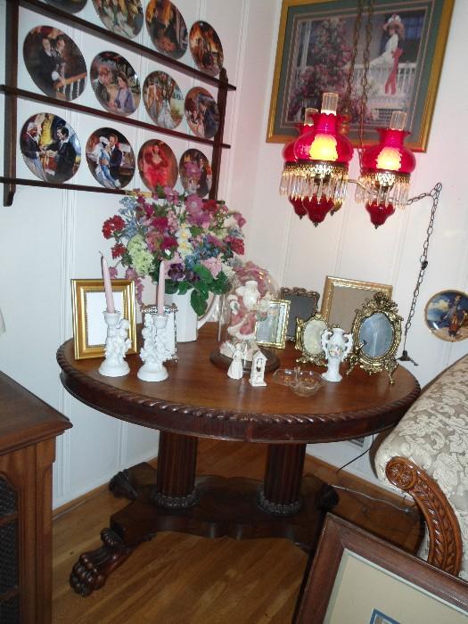 Antique Round, detailed Oak Library Table...with columns...  Notice the hanging 3 ruby Red Chandelier... and more plates to be viewed.