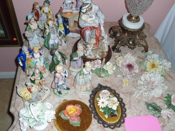 Lots and lots of   Capodimonte - Made in Italy...Beautiful and very delicate....LOOKS so real.
