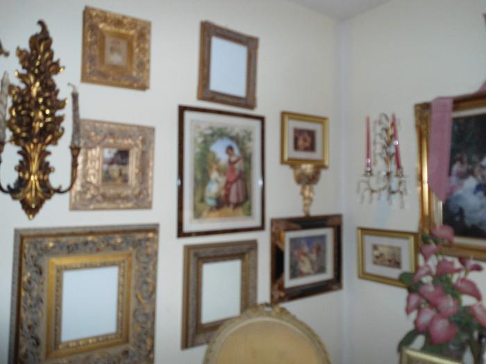 Walls of framed prints, oils, sconces, Crystal hanging decorator items, etc.