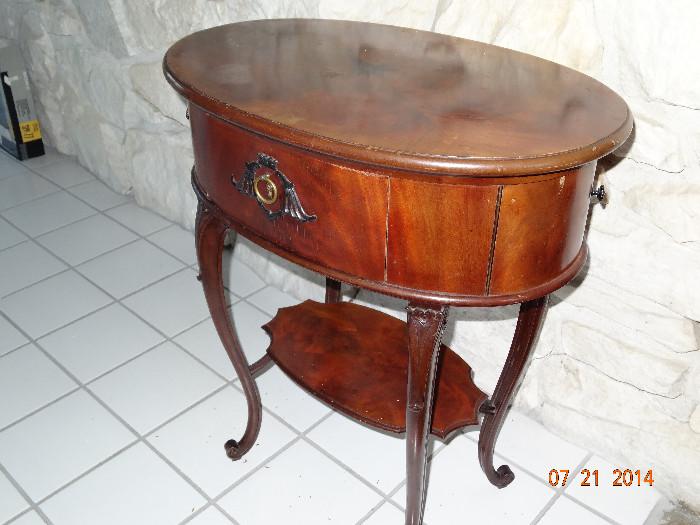 Antique mahogany work table.