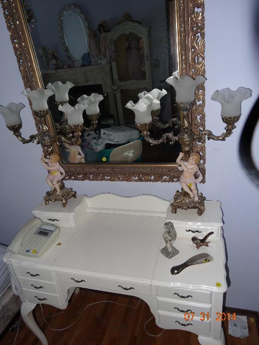 Pair of cherub, multi-arm lamps, mirror and vanity