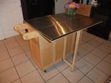 Kitchen Island w/ Stainless Top. Lots of storage, papertowel rack