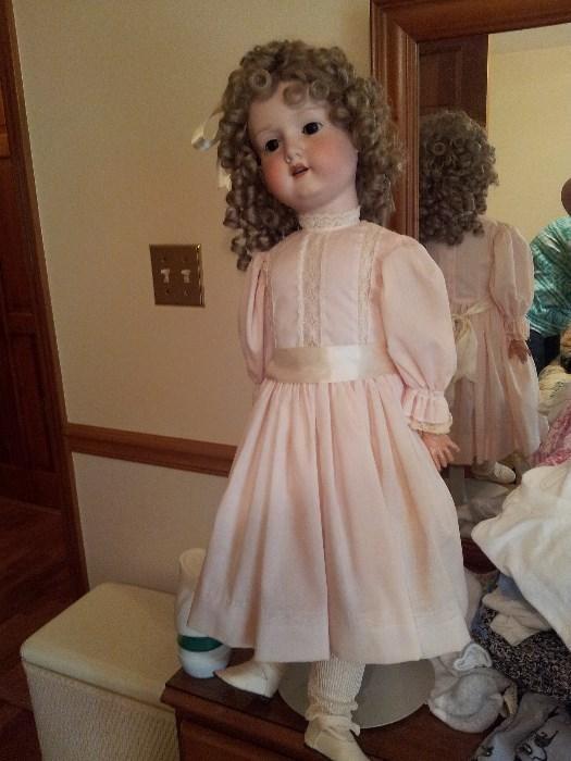 Vintage porcelain tall doll, near mint condition with original clothes and hair, nice jointed arms and legs, markings under nape of hair