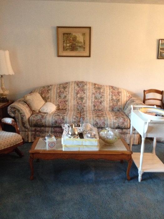 Floral couch, Coffee/Tea/creamer/sugar set, punch bowl with cups, beautiful Vintage Coffee Table with 2 matching End tables (not shown) with Marble inserted tops (French Provincial Style), Vintage Lamp, antique chair and white stand.