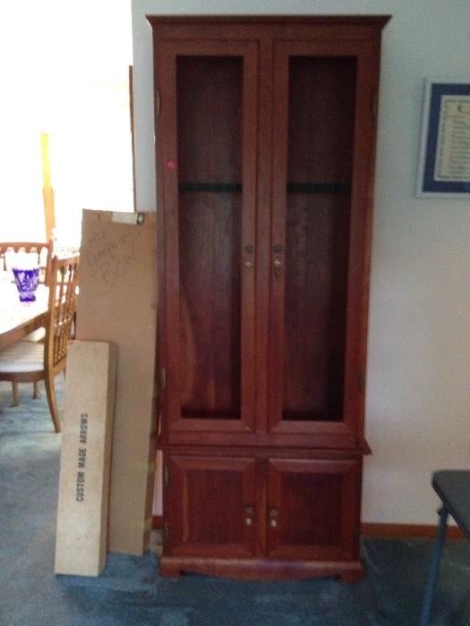 Cherry Gun Cabinet, holds 9 guns, with locking doors, (glass needs replaced); ***1972 Bear Polar II Right Hand Bow with Arrows.