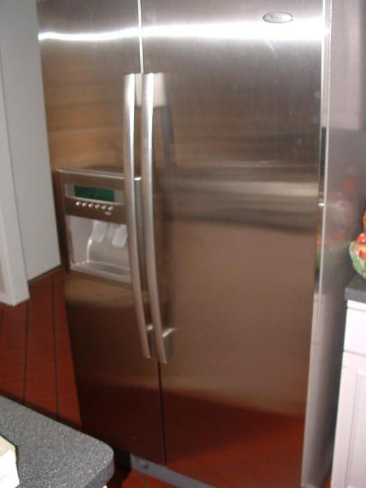 Whirlpool stainless side x side refrigerator with water and ice in door (purchased 2009)