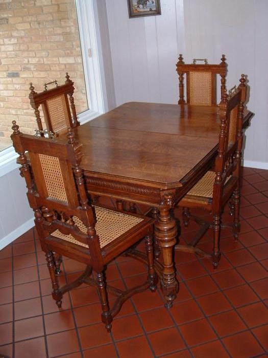 Antique table (with leaf) and 6 chairs (only 4 pictured)