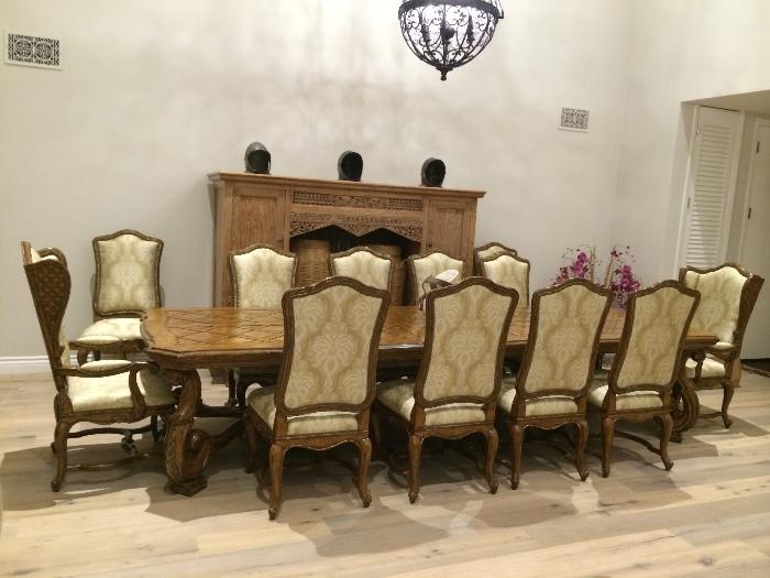 Marge Carson dining table and 12 dining chairs.  Like new, never been used!  Retail price $65,000 Our price $19,000.