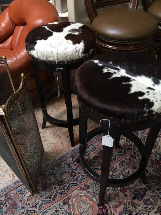 2 cowhide barstools with nail-heads.  Price $350 each.