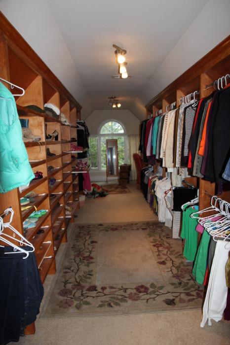 Incredible closet...on the right, full of nice clothes - small to medium, good brands (Anthropologie, Norstrom, etc.) On the left, great collection of high-end shoes.