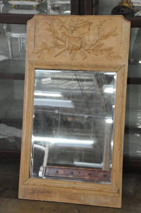 Carved wood trumeau mirror