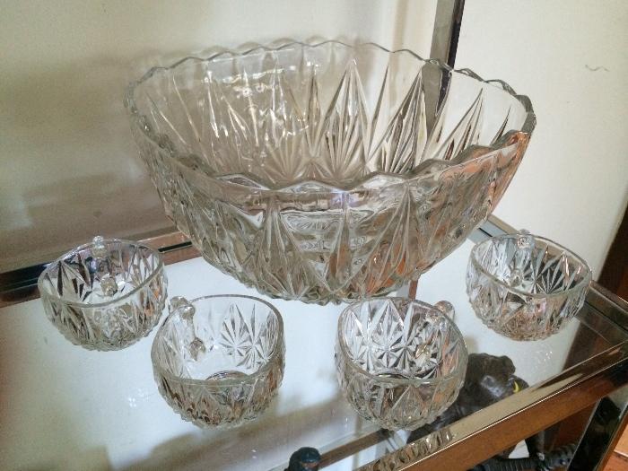 Beautiful crystal punch bowl with 12 glasses comes in original box . 
