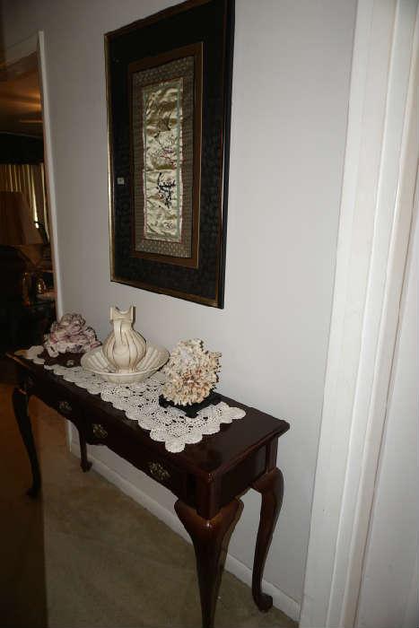 Queen Anne style console hall table, bowl 7 pitcher, barnacle shells & coral, matted silk wall hanging