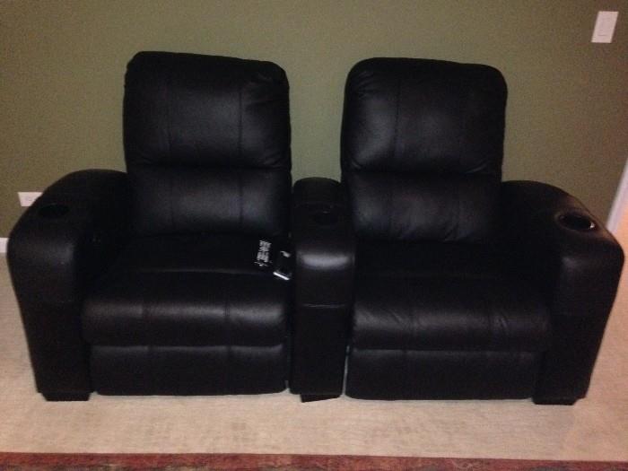 Black leather theater chairs from Dania furniture in like new condition