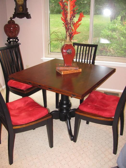 Table and Chars. The table opens to double the size. 4 of 6 chairs shown. Like new condition
