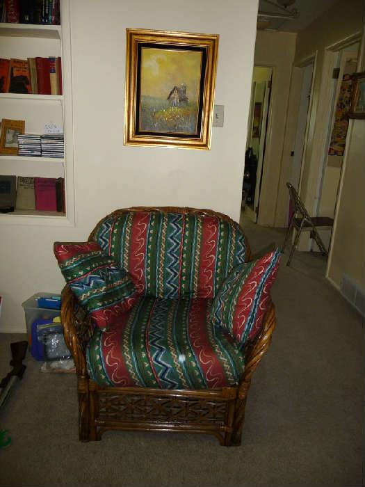 rattan chair , one of several oil paintings