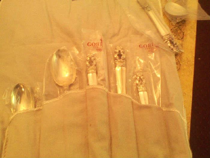 beautiful sterling silver service for 8 with serving pieces, in pristine condition, in original box, wrapped in plastic and kept in felt bags