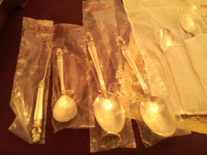 beautiful sterling silver service for 8 with serving pieces, in pristine condition, in original box, wrapped in plastic and stored in felt bags