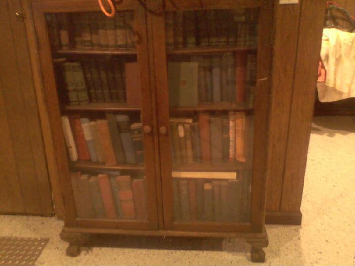 beautiful old bookcase with claw feet and original glass and hardware