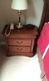 One of two nightstands and lamps