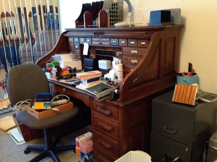 Vintage roll top desk with many drawers, featured in Denver Post