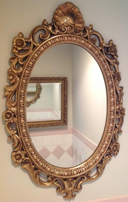 One of many decorative framed mirrors.