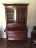 Antique secretary with drop leaf leather top desk.  42" wide by 7'6" tall.