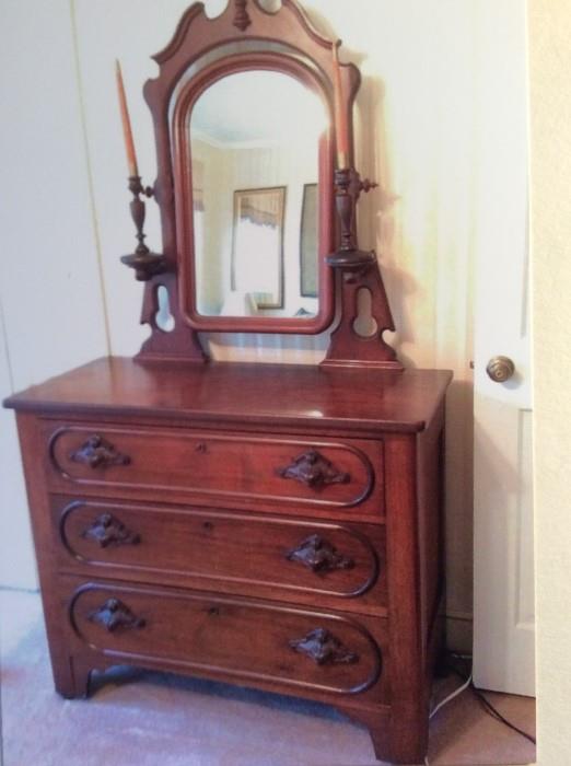 Antique dresser/chest with mirror 3' Tall, 42" long and 18.5" wide, the mirror stands at 41" tall from the top of the chest.  The mirror is 30" at it's widest.  The candle sticks shown are not permanently attached, just to show how this piece was used last century.